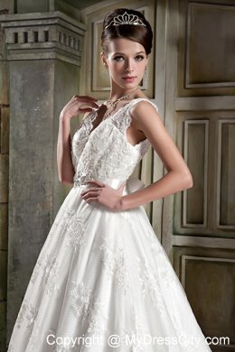 Beautiful V-neck Chapel Train Beaded Wedding Dress in Lace