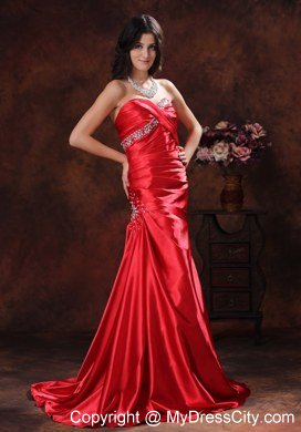A-line Red Sweetheart Ruching Celebrity Dress With Brush Train Beading