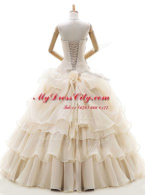Fabulous Champagne Lace Up Wedding Gown Appliques and Ruffled Layers and Pick Ups and Hand Made Flower Sleeveless Floor Length