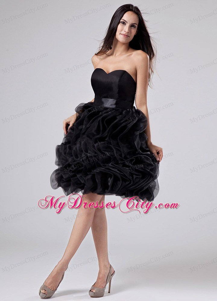 Black cocktail dress with ruffles
