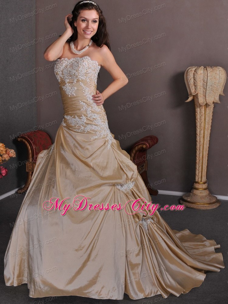 Champagne Strapless A-line Appliques Chapel Train Wedding Gown