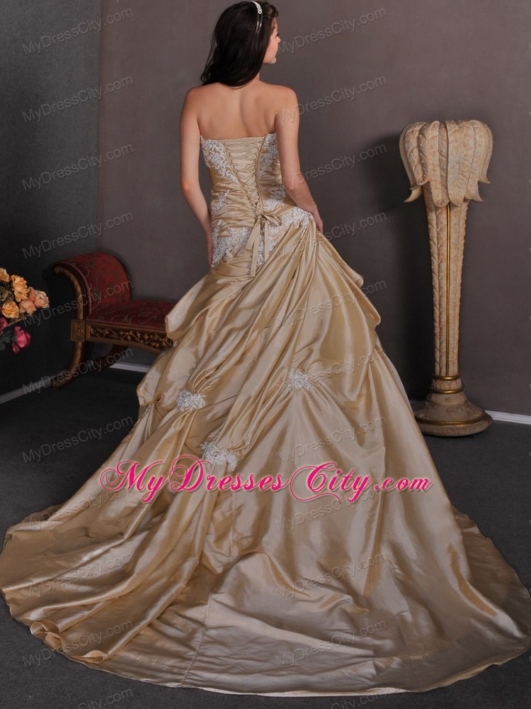 Champagne Strapless A-line Appliques Chapel Train Wedding Gown